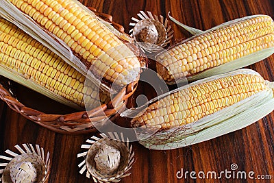 Corn cobs with straw hat miniatuares. June Party Food, Brazilian food Stock Photo