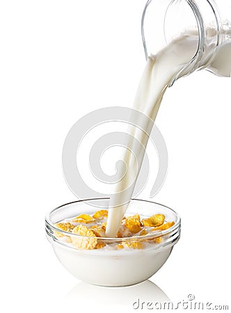 Corn flakes with flowing milk Stock Photo