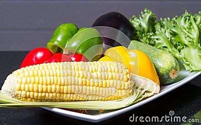 Corn, paprika, cucumber and lettuce. Stock Photo