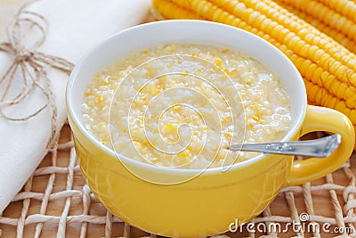 Corn porridge in yellow bowl Stock Photo