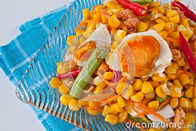 Corn salad with salted egg spicy-sour dressing. Stock Photo