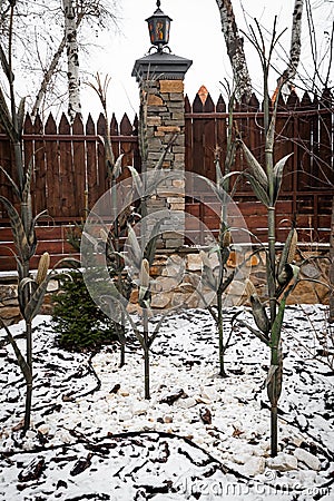 Corn stalks and ears forged from steel by skilled blacksmiths. Stock Photo