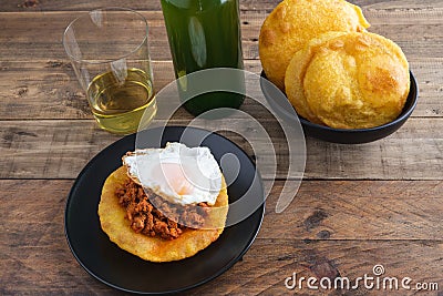 Corn tortos with picadillo and fried egg. Typical Asturian cuisine. Copy space Stock Photo