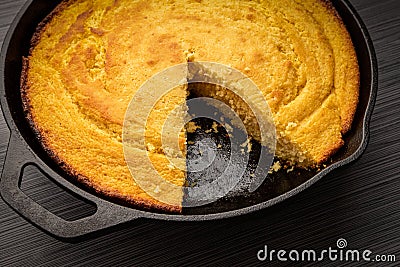 Cornbread baked in a cast iron skillet Stock Photo