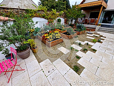 corner of the family garden with several beds bordered by boards. there Stock Photo