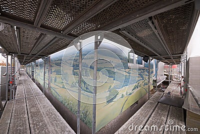 Corner of a lovely rural German landscape mural on a high-rise building in silicate paint, in Langen from a large facade scaffold Editorial Stock Photo