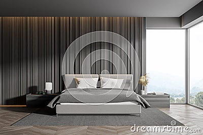 Corner of master bedroom with grey wooden walls panoramic window with countryside view comfortable king size bed standing on Stock Photo