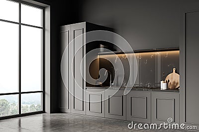 Corner of panoramic dark grey kitchen with accent marble backsplash Stock Photo