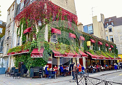 Corner street restaurant in the Jewish quarter of Paris Editorial Stock Photo