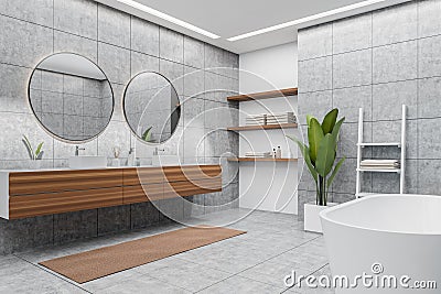 Corner view on bright bathroom interior with bathtub, round mirrors Stock Photo