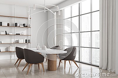 Corner view on bright kitchen interior with dining table, window Stock Photo