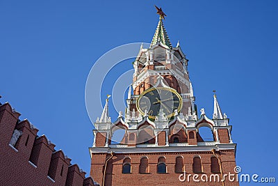 A corner view of Spasskaya Tower, translated as Saviour Tower, it`s the main tower on the eastern wall of the Moscow Kremlin which Editorial Stock Photo