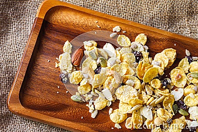 Cornflakes with almond, honey, sesame and dried fruits Stock Photo