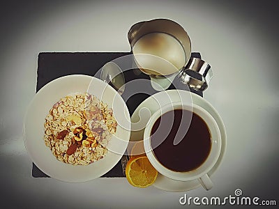 Cornflakes cereals milk tea lemon breakfast Stock Photo