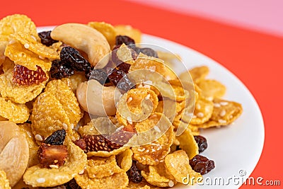 Cornflakes honey caramel homemade with grains, currant, cashew nut, dried strawberries and white sesame healthy food snack on a Stock Photo