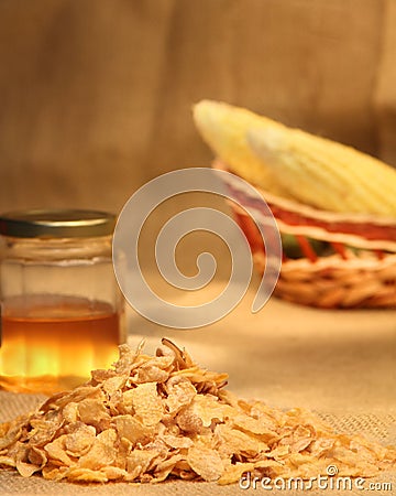 Cornflakes with honey and corn cobs Stock Photo