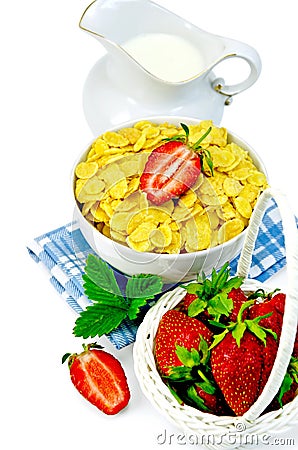 Cornflakes with milk in a jug and strawberries Stock Photo