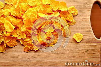 Cornflakes on wood cutboard Stock Photo