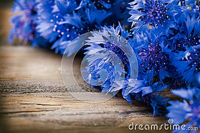 Cornflowers over wood Stock Photo