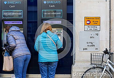 Cornmarket Street, Oxford, United Kingdom, January 22, 2017: Customers using a Barclays Bank ATM Bancomats Free Cash Withdrawals Editorial Stock Photo