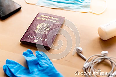 Corona virus travel and tourism concept, italian passport and face mask as symbol of the traveling industry crisis and the new Stock Photo