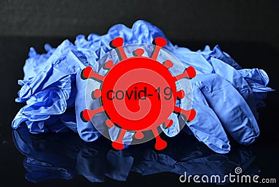 Coronavirus, concept.Disposable blue medical latex gloves on black background. Hygiene rules during the coronavirus epidemic.Healt Stock Photo