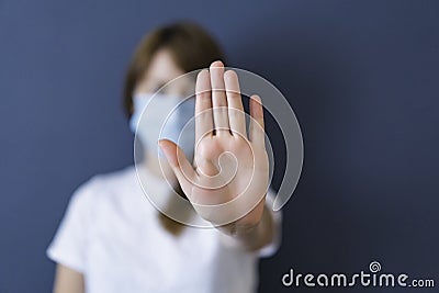 Coronavirus concept. Girl wearing mask for protection from disease and show stop hands gesture for stop corona virus Stock Photo