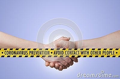 Coronavirus covid-19 concept: a safety tape with advice to avoid contact with other people in front of a man and a woman shaking Stock Photo