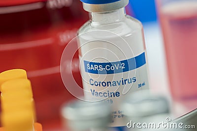 Coronavirus covid-19 experimental vaccine in a laboratory, conceptual image, unbranded generic drug containers and hypothetical Stock Photo