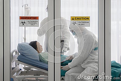 Coronavirus covid-19 infected patient on bed in quarantine room with quarantine and outbreak alert sign at hospital with disease Stock Photo
