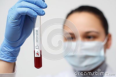 Coronavirus COVID 19 nCov Outbreak. medical or scientific holding Corona Virus Blood Test Tube from Patient. Positive Case of Stock Photo