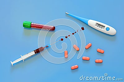 Coronavirus Covid-19 SARS test, blood syringe, medical test tube blood, thermometer high temperature, pills , biochemistry Stock Photo