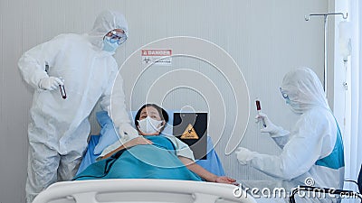 Coronavirus covid 19 treatment background of coronavirus covid 19 patient on bed with doctors in PPE coverall suit in hospital Stock Photo