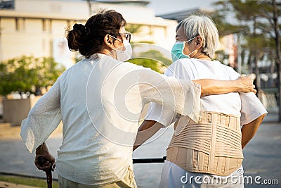 Coronavirus ended,Happy old people,asian senior women are walking in public outdoor,end of social distancing,end of stay home,end Stock Photo