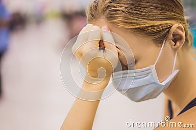 Coronavirus in the hospital covid 19. Woman in a medical mask Patients In Doctors Waiting Room Stock Photo