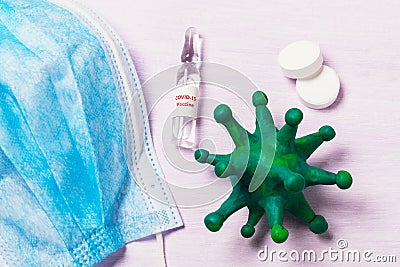 Coronavirus mockup, medical mask and vaccine ampoule from COVID-19 Stock Photo
