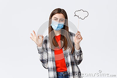 Coronavirus outbreak, leisure on quarantine, social distancing and emotions concept. No problem, girl have good idea Stock Photo