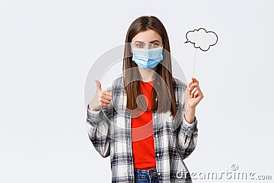 Coronavirus outbreak, leisure on quarantine, social distancing and emotions concept. Pleased young determined girl in Stock Photo