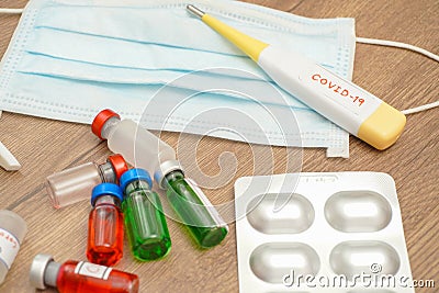 Coronavirus outbreak, Virus and recovery concept, there are a lot of vaccine bottles with red or green liquid Stock Photo