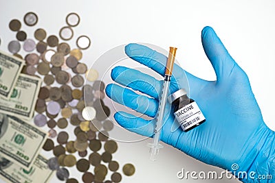 Coronavirus vaccine cost. vaccine ampoule and money. Fight against Covid-19. Pevention, immunization and treatment Stock Photo