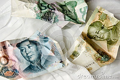 Coronavirus Wuhan illness concept. Chinese money and medical mask Stock Photo