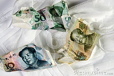 Coronavirus Wuhan illness concept. Chinese money and medical mask Stock Photo