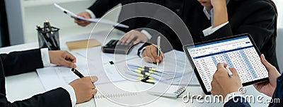 Corporate accountant use accounting software on laptop. Shrewd Stock Photo