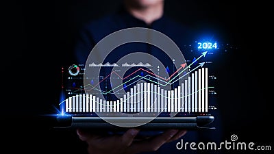 Corporate business figures and future growth arrow chart 2024 year. Analyst work in Business Analytics and Data Management System Stock Photo