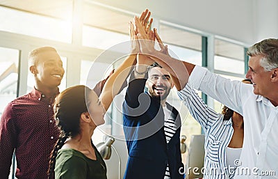 Corporate businesspeople celebrate success in an office. Passionate people feeling motivated, confident and cheerful Stock Photo