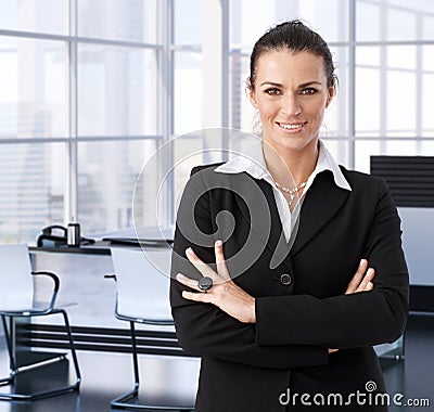 Corporate businesswoman in executive office Stock Photo