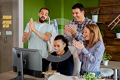 Corporate coworkers being happy of a big sale Stock Photo