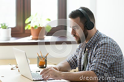Corporate employee watching training video on his laptop compute Stock Photo