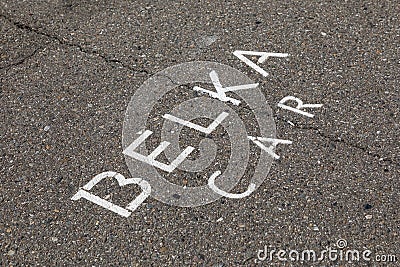 Corporate inscription of Russian car-sharing company BELKA CAR on asphalt indicates the parking place. Car rental is available Editorial Stock Photo