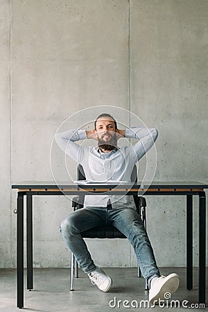 Corporate life confident hipster guy office desk Stock Photo